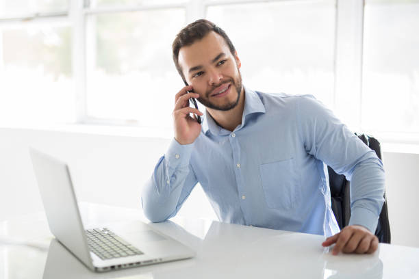 istock mexican attractive businessman on his 30s working at modern home office with computer laptop 1075100842