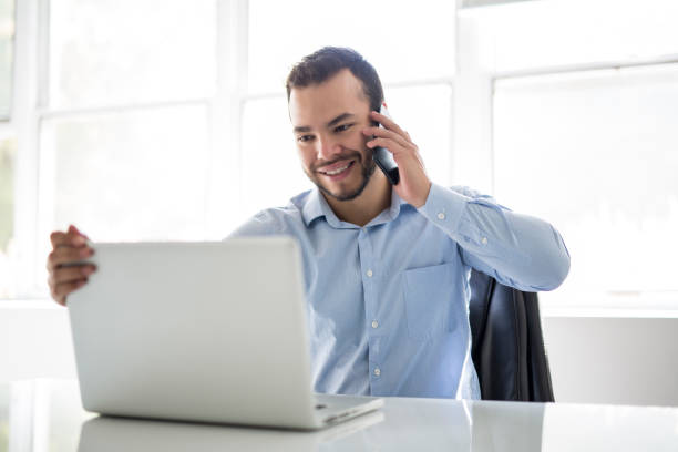 istock mexican attractive businessman on his 30s working at modern home office with computer laptop 1075100846