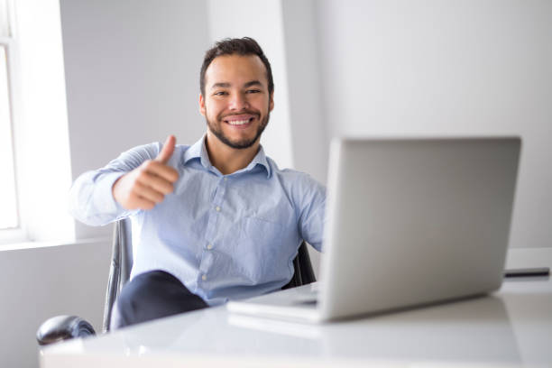 istock mexican attractive businessman on his 30s working at modern home office with computer laptop 1075100860
