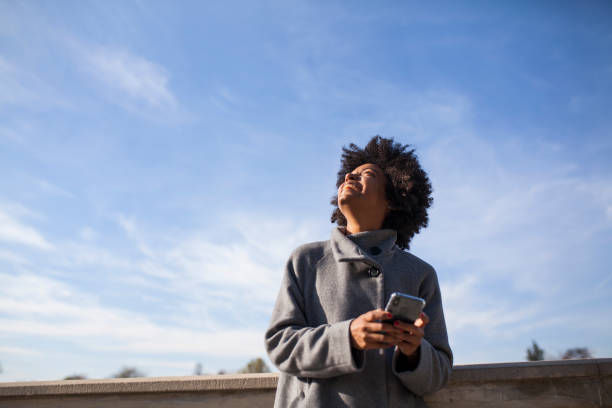 istock Afro woman having fun in the park 1075104440