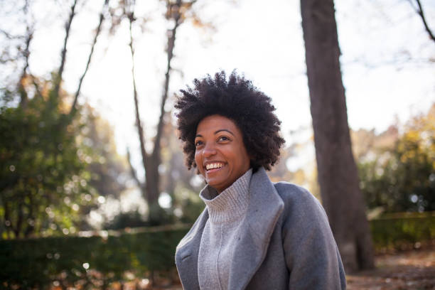 istock Afro woman having fun in the park 1075104474
