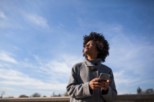 istock Afro woman having fun in the park 1075104482