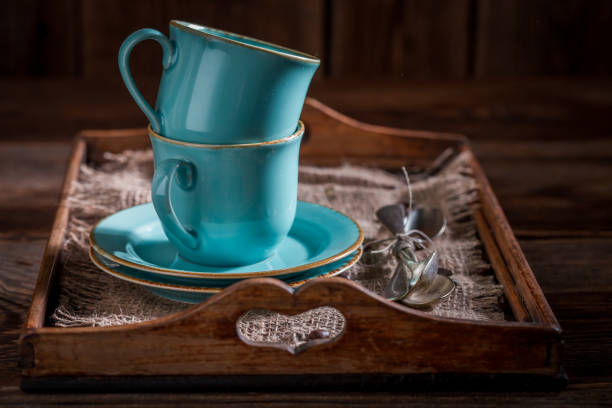 Blue rustic coffee cup and a plate on wooden tray