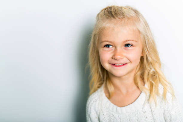 istock A Cute girl 5 year old posing in studio 1075108742