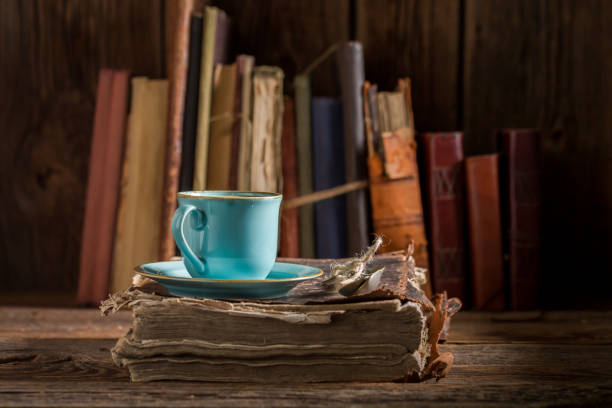 istock Rustic coffee in blue porcelain on book in library 1075110964