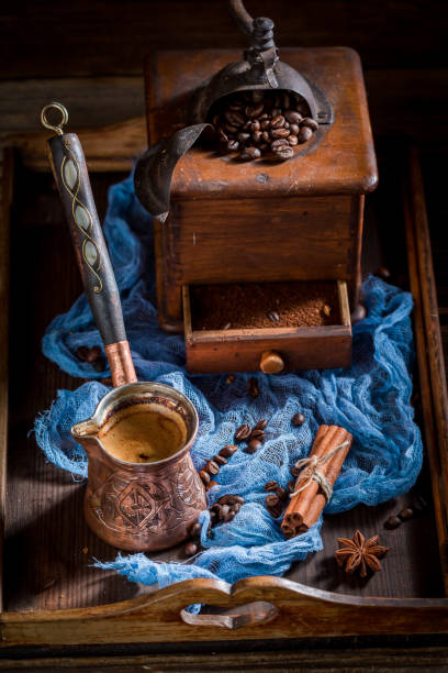 istock Fresh coffee with pot boiled coffee and beans on blue 1075112810