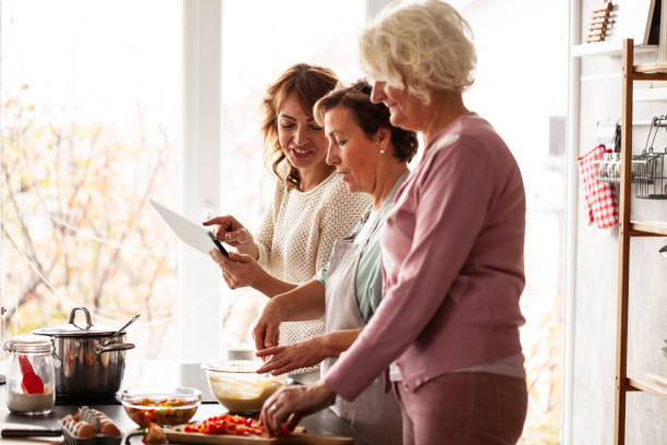 family preparing lunch - great grandmother imagens e fotografias de stock