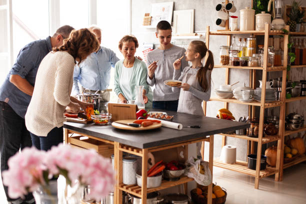istock Multi generation family preparing food together 1075115200