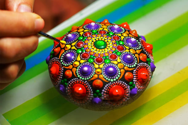 istock Beautiful mandala painted on a stone 1075115320