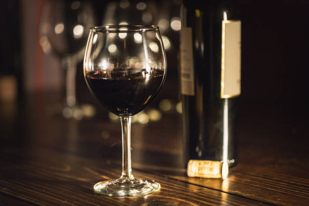 istock Wine bottle with cork and glasses on a table 1075118102