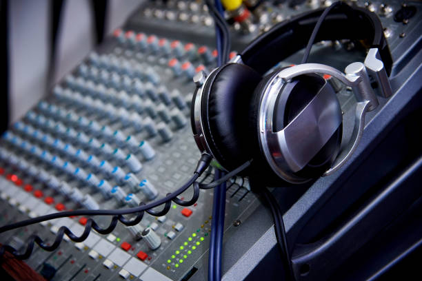 istock Headphones on a dj control panel close-up. 1075119102
