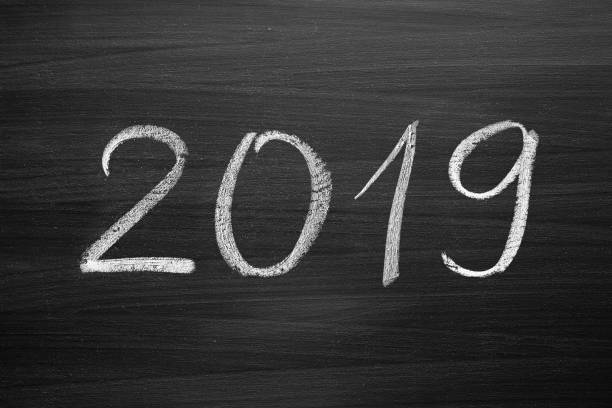 istock 2019 Happy New Year, written with a chalk on the blackboard 1075119450