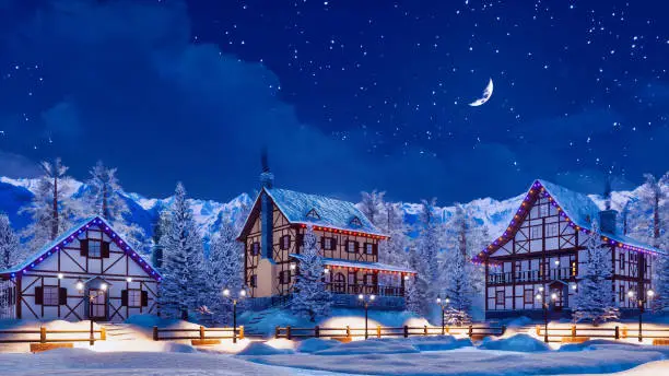 Photo of Snowbound alpine mountain town at winter night