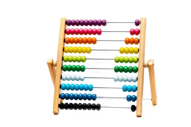 Traditional abacus with colorful wooden beads on white background, mathematics toy