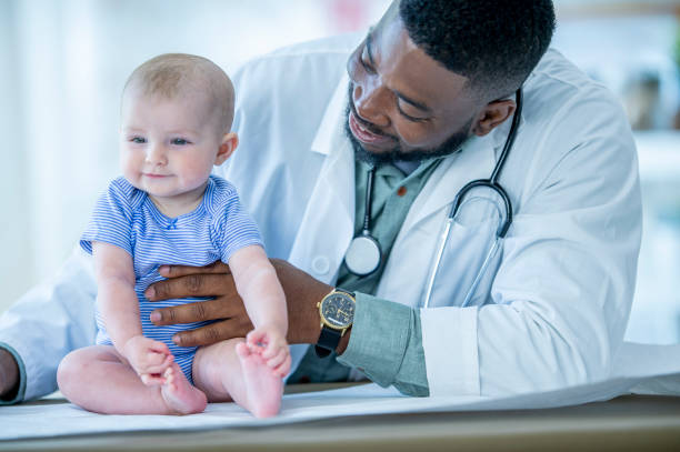 istock Doctor with smiling baby 1075131372