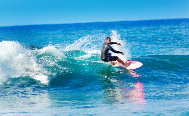 istock Surfer Surfing in Poipu Beach, Kauai,Hawaii 1075131874