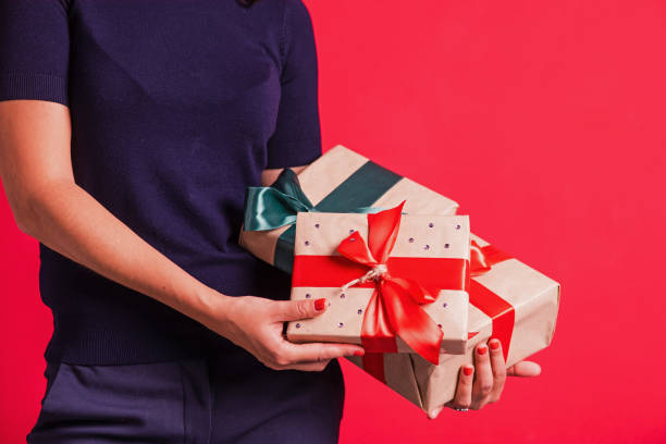 istock Christmas New year gift boxes with red green bow 1075135350