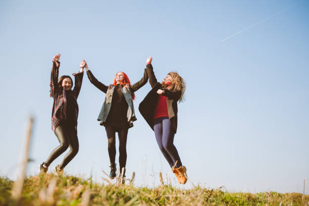 Portrait of happy young friends outdoors