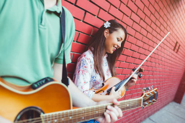 istock Musicians with guitar and violin 1075149190