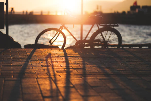 istock silhouette of bicycle at sunset 1075149352
