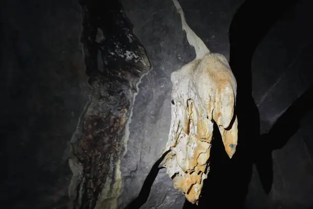 Rock formations of grey limestone with speleogens and reddish speleothems of incipient stalactites in St.Paul's Underground River Cave. Puerto Princesa Subterranean River Nnal.Park-Palawan-Philippines