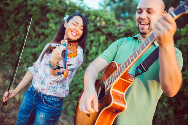 istock Musicians with guitar and violin 1075151198