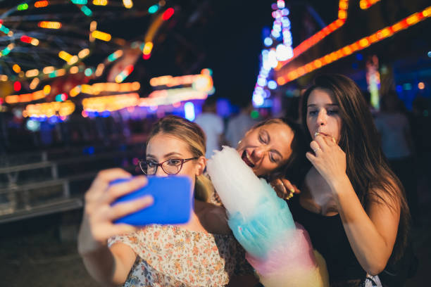 istock Girls taking selfies with cotton candy 1075157892