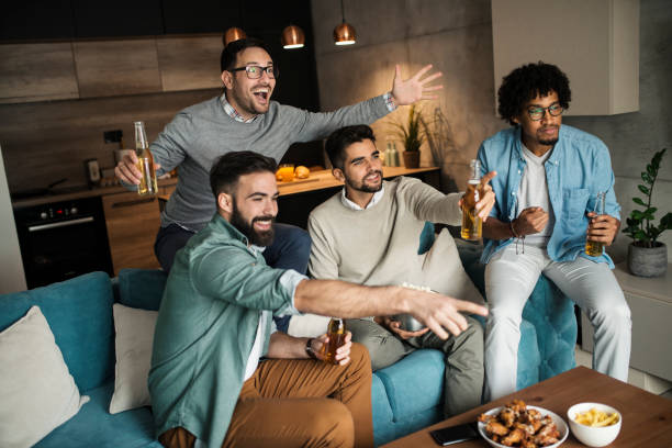 istock Friends watching sport on tv. 1075160334
