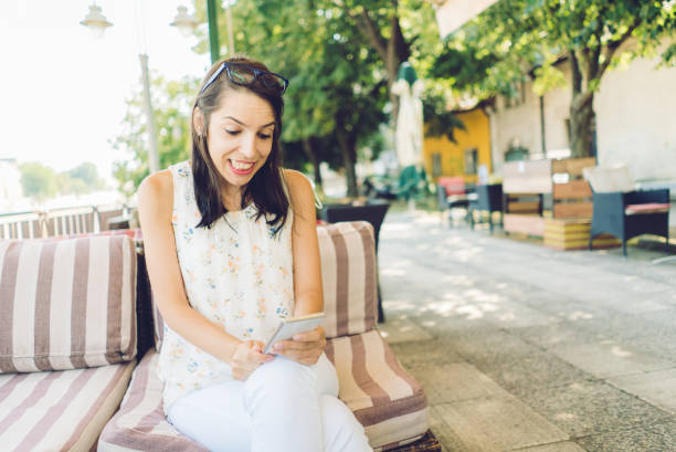 istock Girl using her smartphone outdoor 1075174530