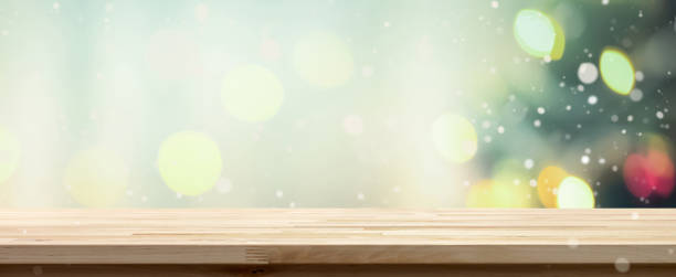 istock Wood table top on bokeh background from decorated Christmas tree, panoramic banner 1075181290