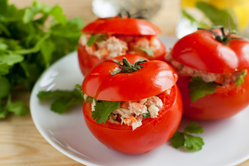Fresh ripe tomatoes stuffed with canned tuna and vegetables