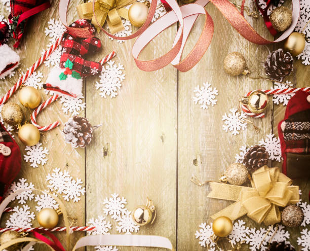 istock festive background concept with christmas decorating items on wooden background with light filter 1075186162