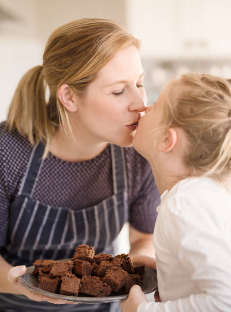 istock Mom and daughter baking in the kitchen 1075199522