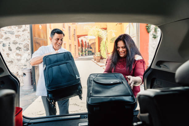 istock Senior Couple arrive at Mexican Hotel 1075202664