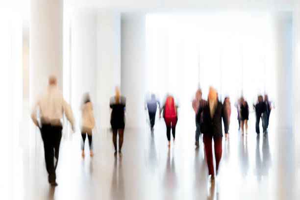 istock Motion Blurred Group of Businesss People 1075205388