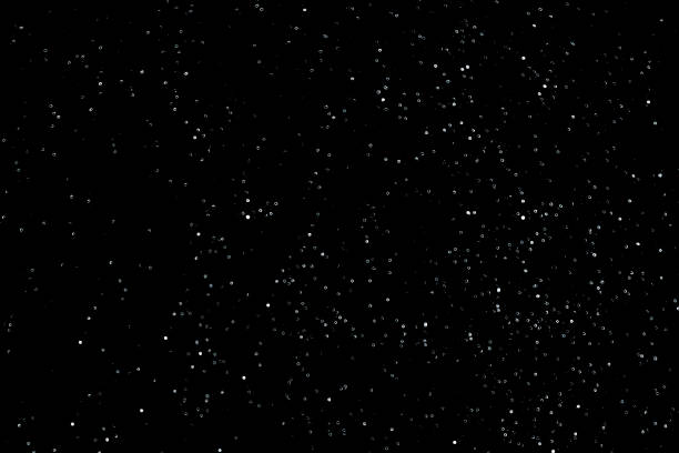 istock Texture of snow or starry sky isolated on black background 1075211174