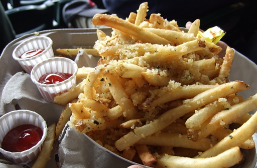 Seattle, United States - July 23, 2008 : It is the Safeco Field, home of Seattle Mariners. A lot of garlic is on the french fries. Very delicious! It fits beer.