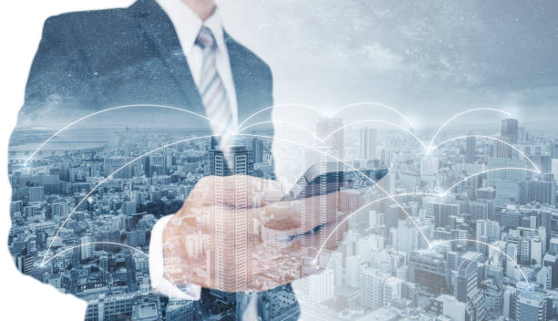 istock Double exposure businessman using mobile smart phone, and network connection technology in the city. Business network, blockchain technology and internet connection 1075244294