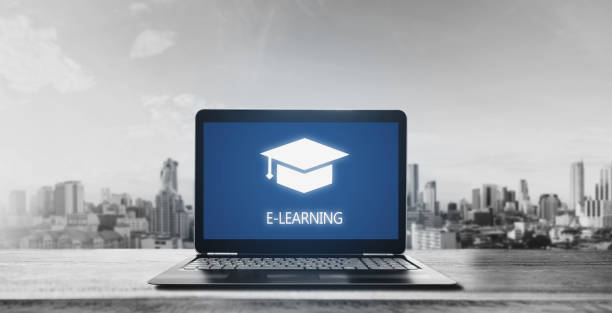 istock E-learning on computer laptop and city sunrise background. Online education, e-learning and e-book concept 1075244728