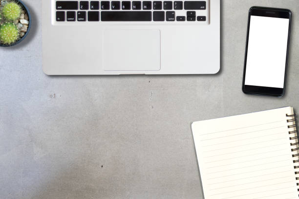 istock Working table with laptop and book and mobile phone, copy space, use for template and presentation background 1075245020