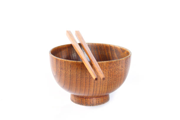 istock bowl and chopsticks wooden on white background. 1075257860
