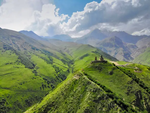 aerial view of Caucasus mountain with Trinity Church of Gergeti