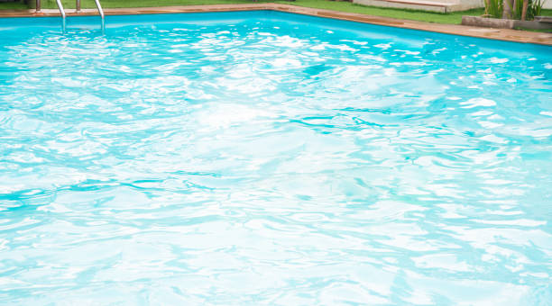 istock Blur blue water in swim pool. 1075263698