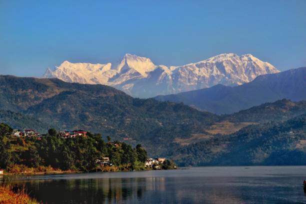 istock Majestic  mountain  shining brightly  above  the lake 1075267438