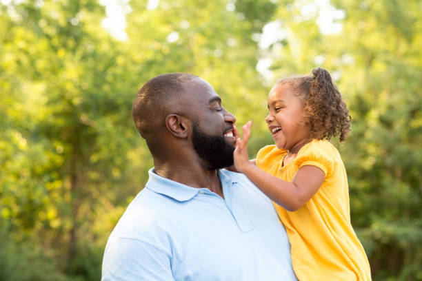 istock Father laughing and playing with his daugher. 1075278488