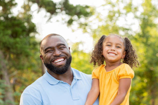 istock Father laughing and playing with his daugher. 1075278496