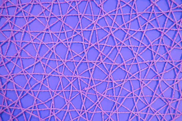istock woven mesh of artificial material on a violet background 1075278590