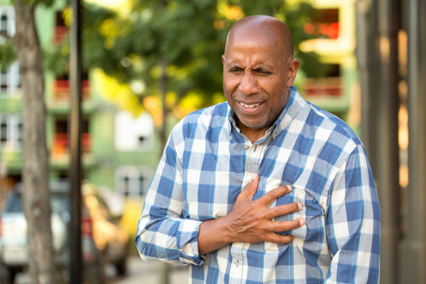 istock African American man having pains holding his chest. 1075278840