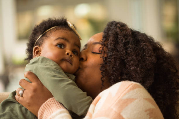 istock Happy African American mother and her daugher. 1075283732