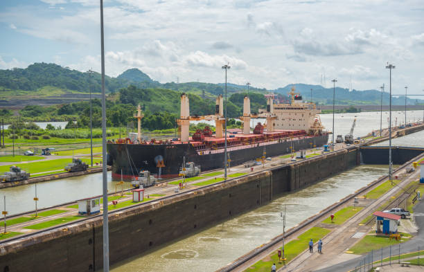 istock Cargo ship passes through lift locks of the Panama Canal. 1075287012